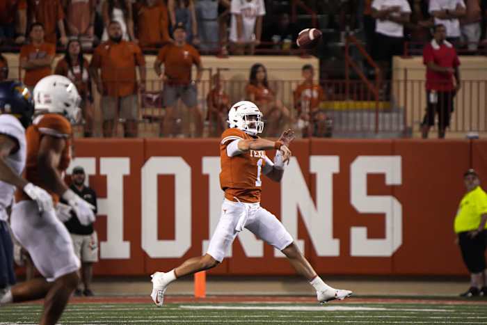 Texas quarterback Hudson Card (1) throws a pass during the game against West Virginia at Royal Memorial Stadium in Austin, Texas